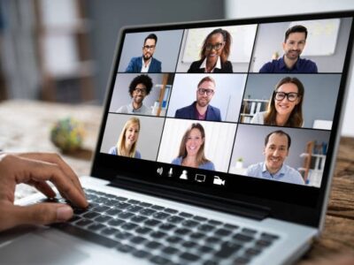 Online-course-Virtual Team Meeting on Video Call - MRCEMMASTER Laptop screen showing a virtual meeting with a diverse group of professionals on a video call, symbolizing remote collaboration and teamwork.